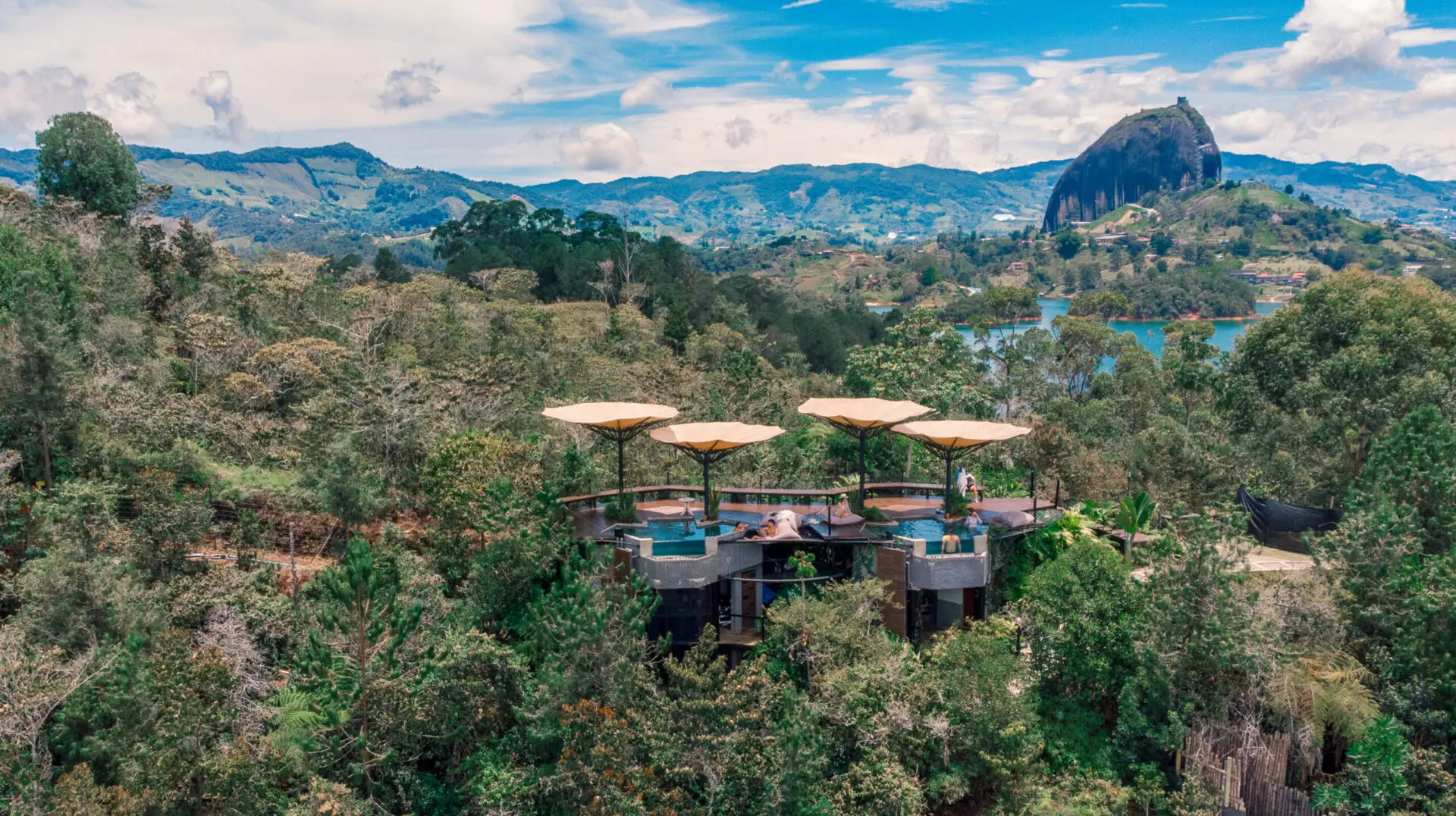 glamping resort nestled in the mountains near a lake