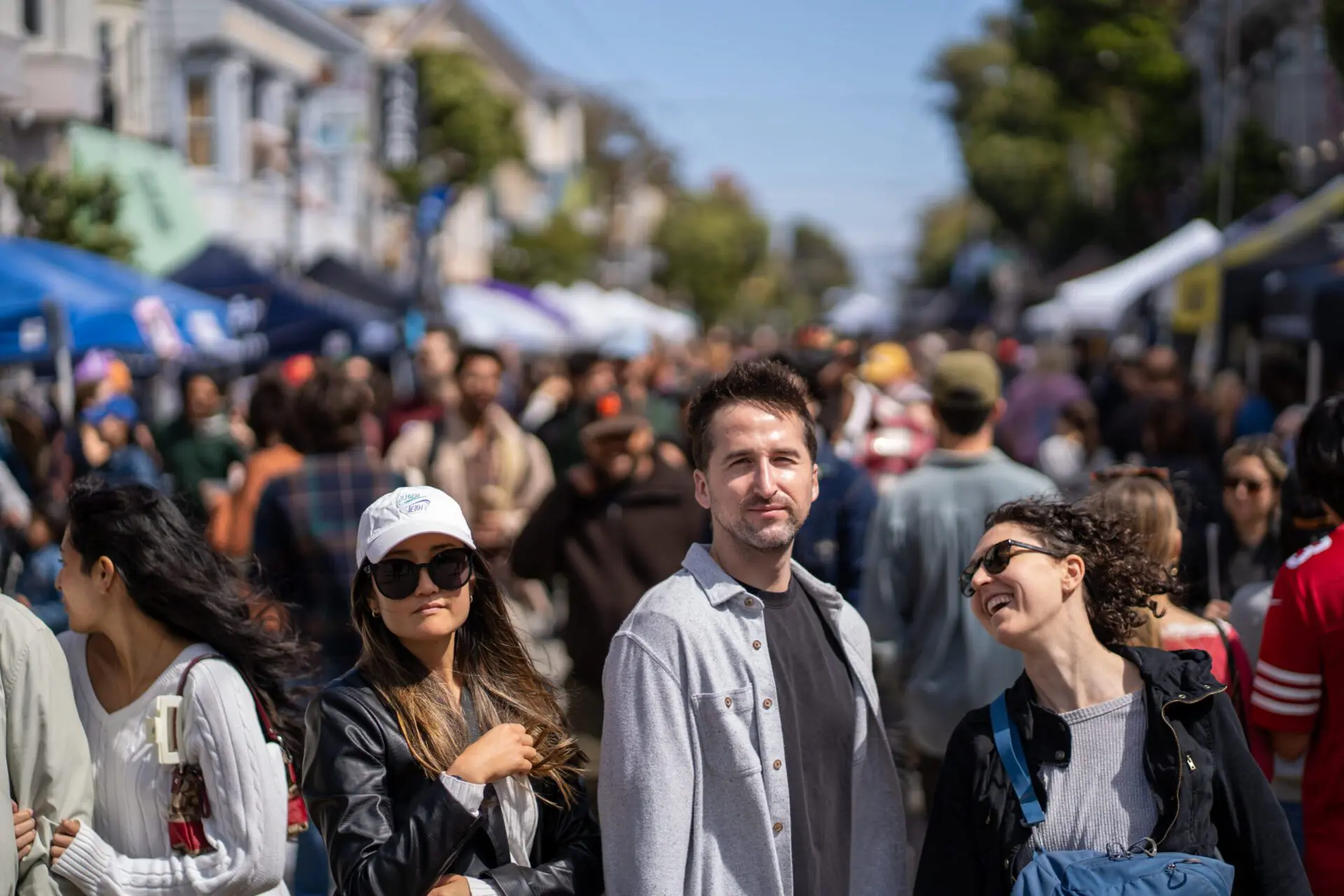 People standing at a street fair on Haight Street