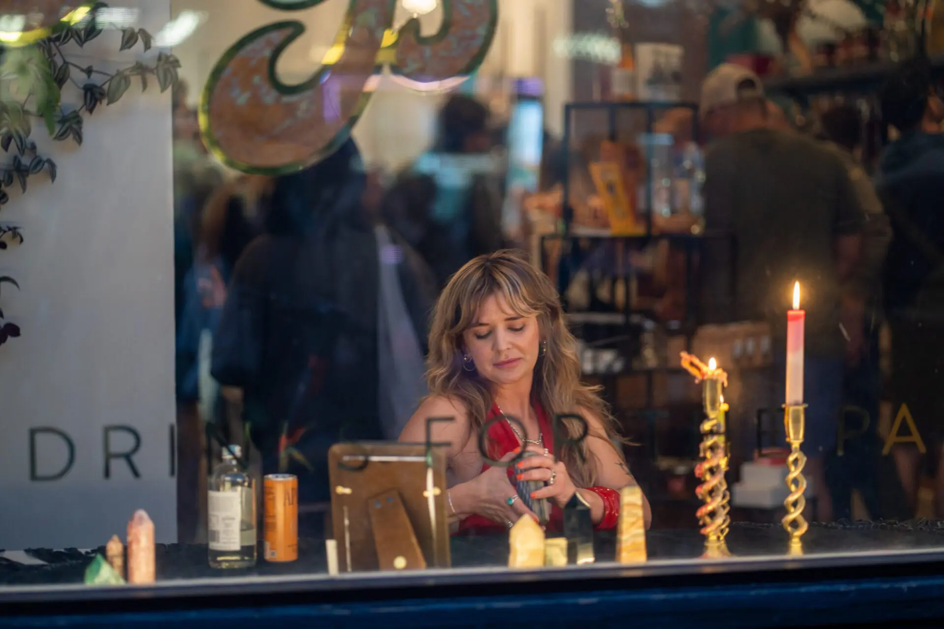 Woman doing tarot readings behind a candlelit bar inside a Castro restaurant