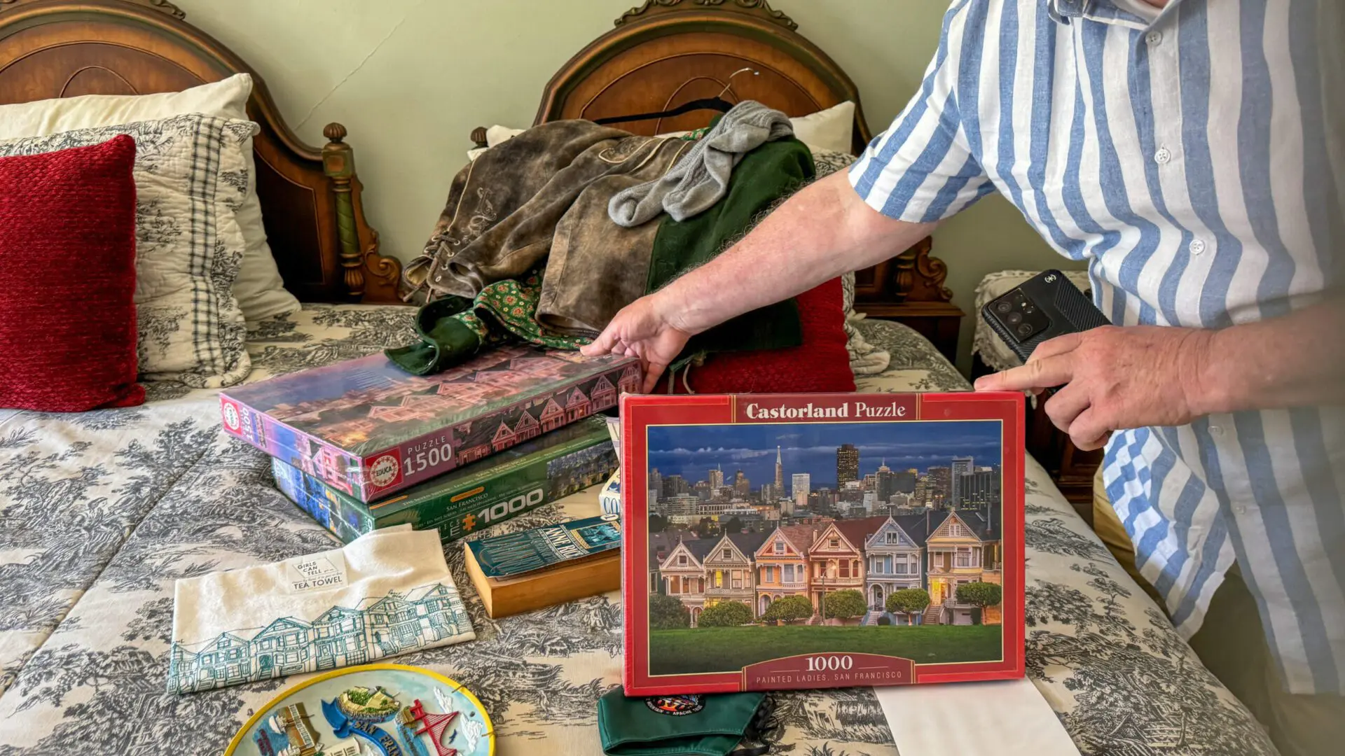 Victorian room with books, framed photos, and personal artifacts on display