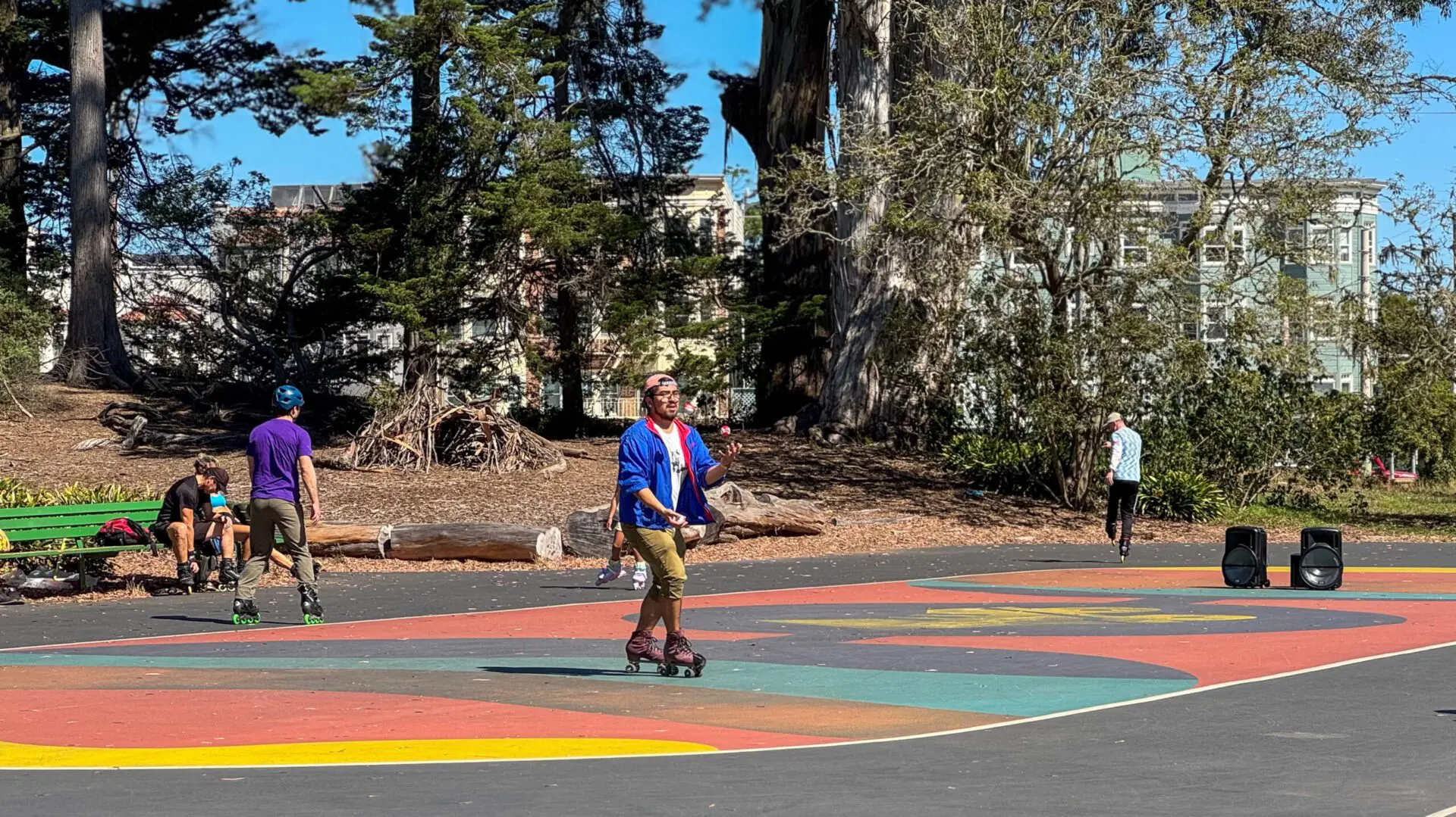 Cyclists stopped near a Golden Gate Park bike lane