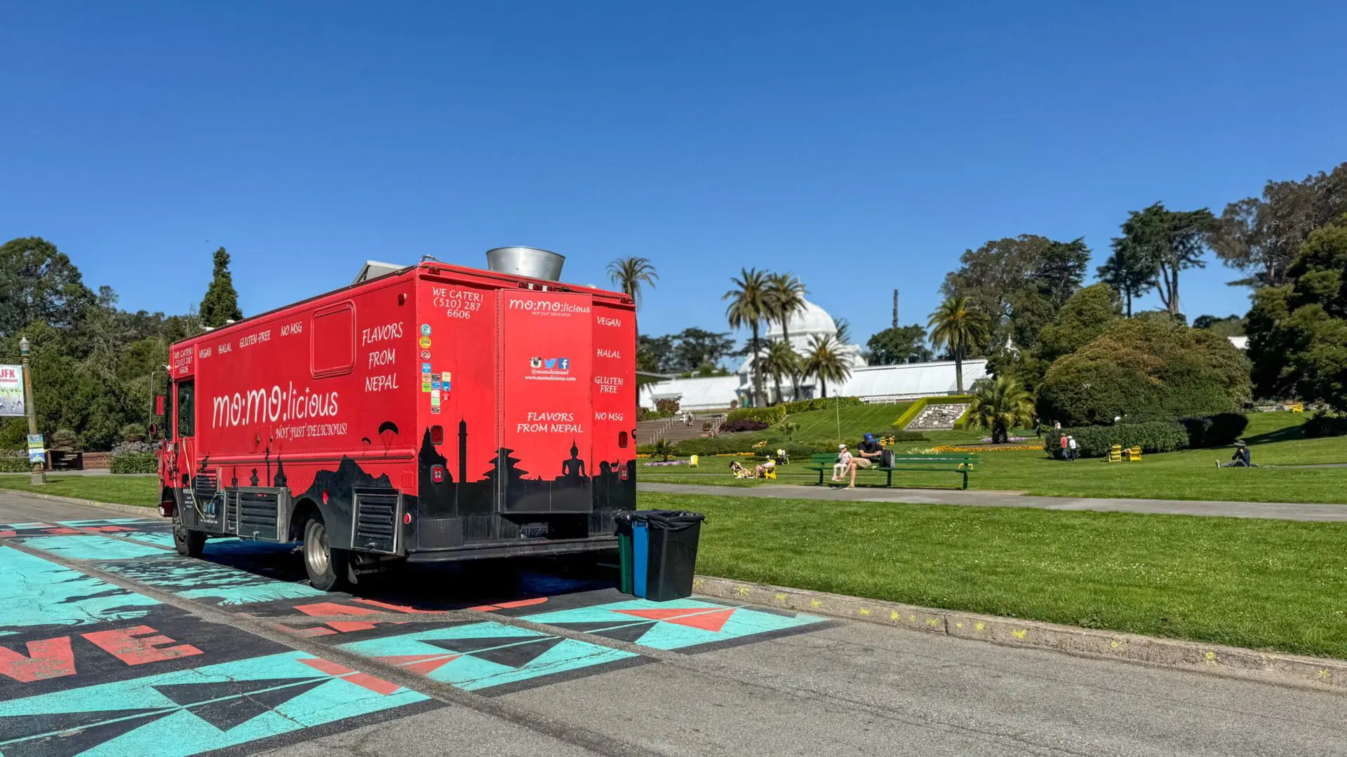 Red food truck on display in the middle of Golden Gate Park