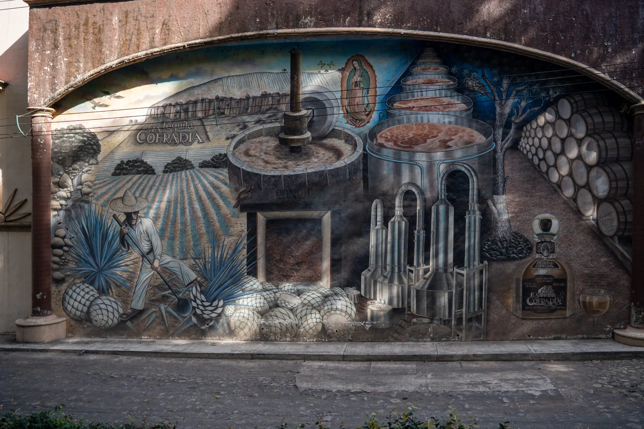 Mural depicting ancient architecture and figures around a stone structure.