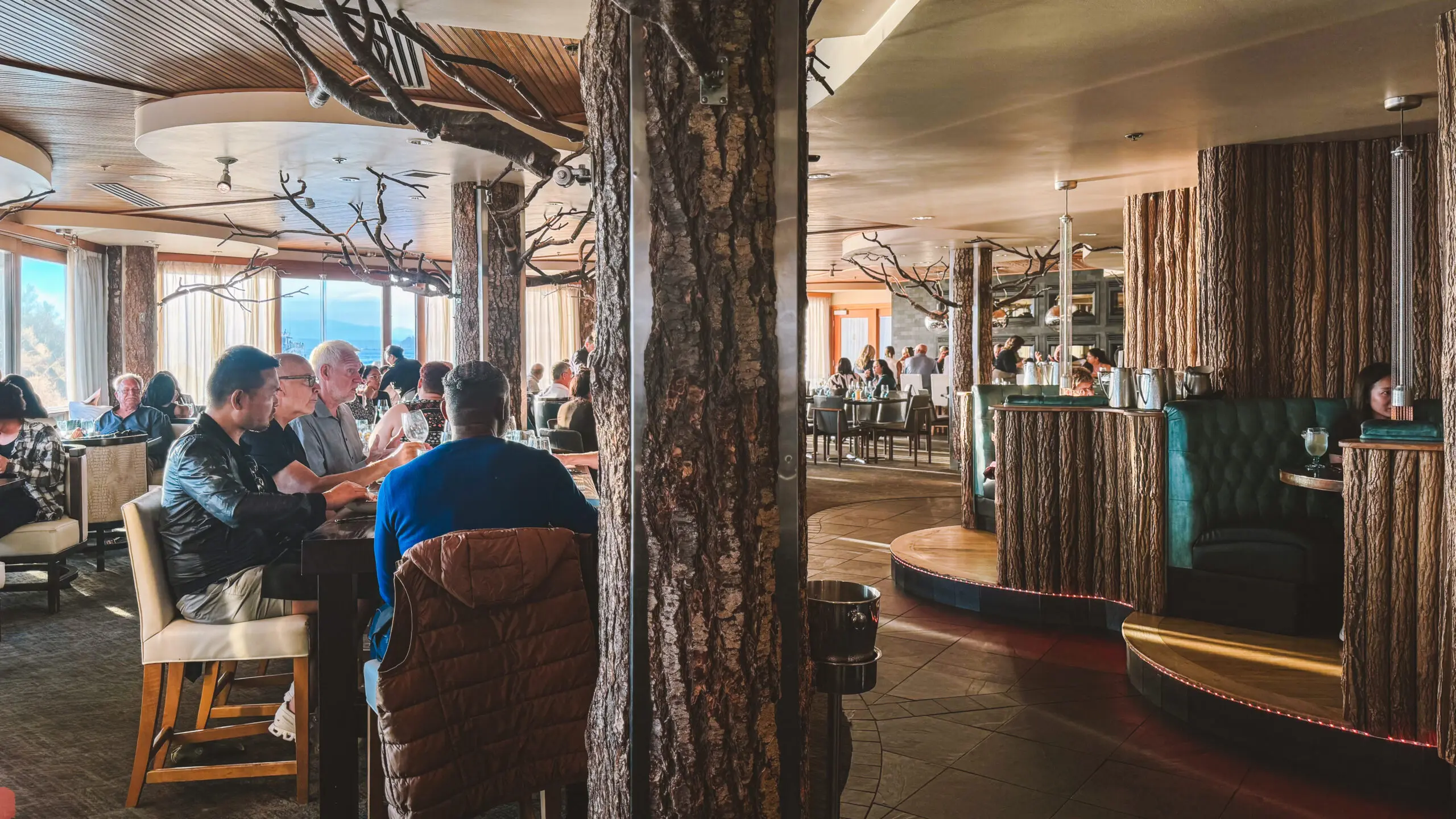 Cozy café interior with wooden decor and patrons enjoying their time.