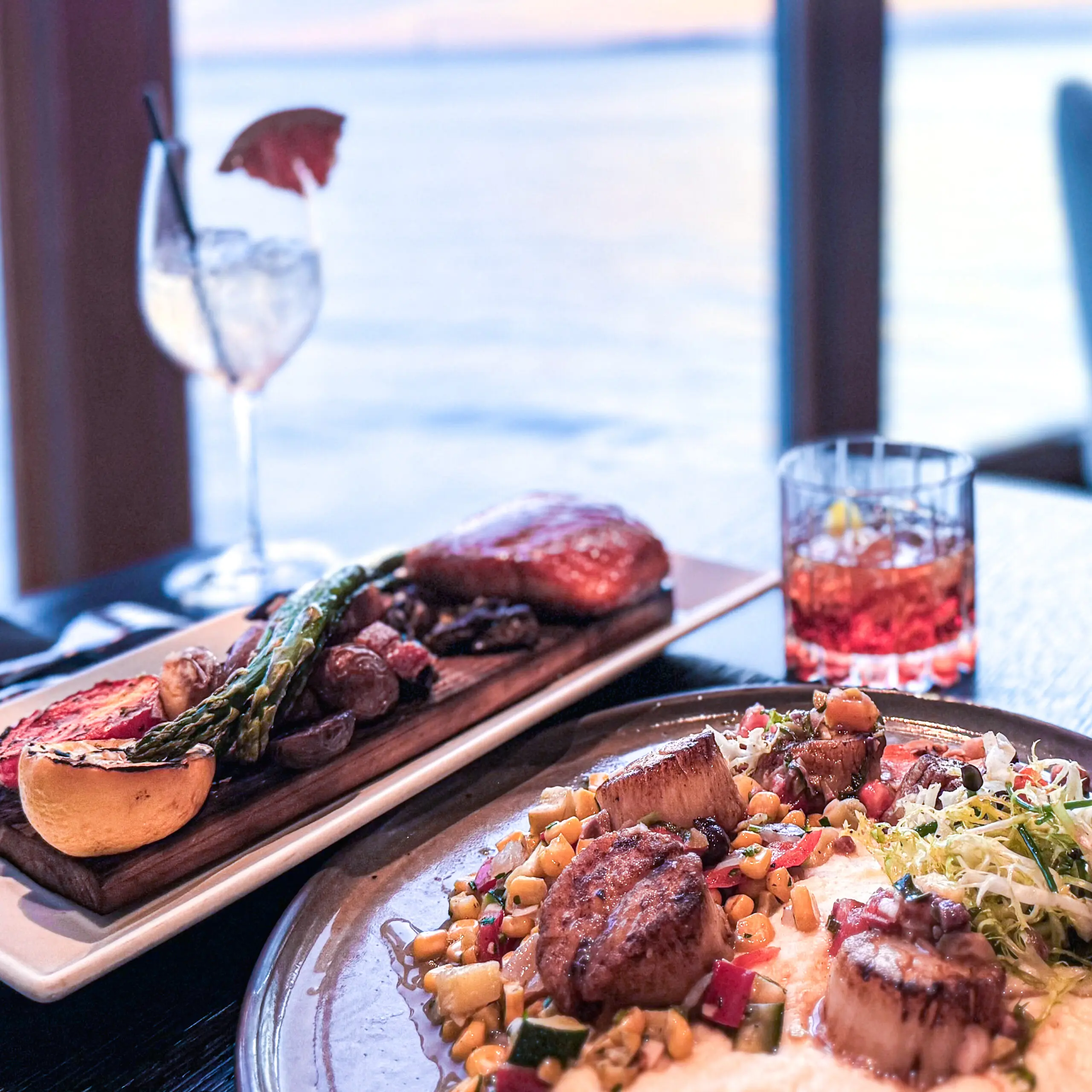 Elegant gourmet dishes with steak and seafood paired with wine and whiskey.