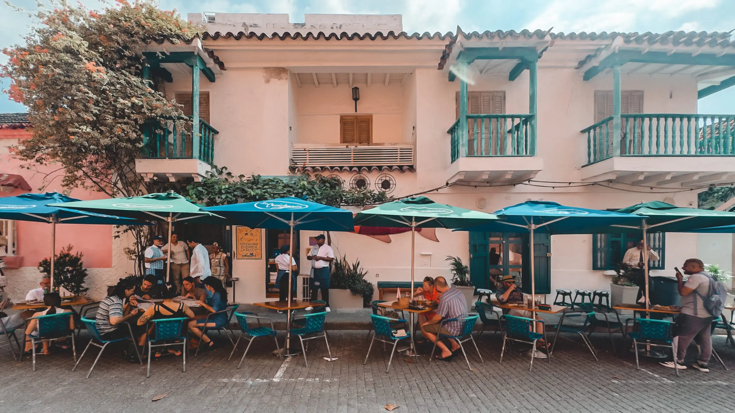 aerial view of a resturants on a wall of an ancient city, overlooking the Caribbean sea