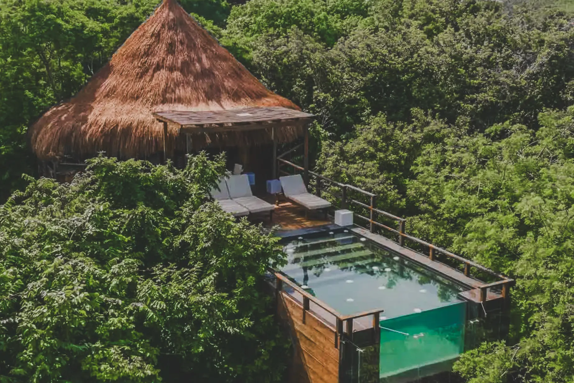woman with a bob haircut holding a camera up to her face with a light in the background