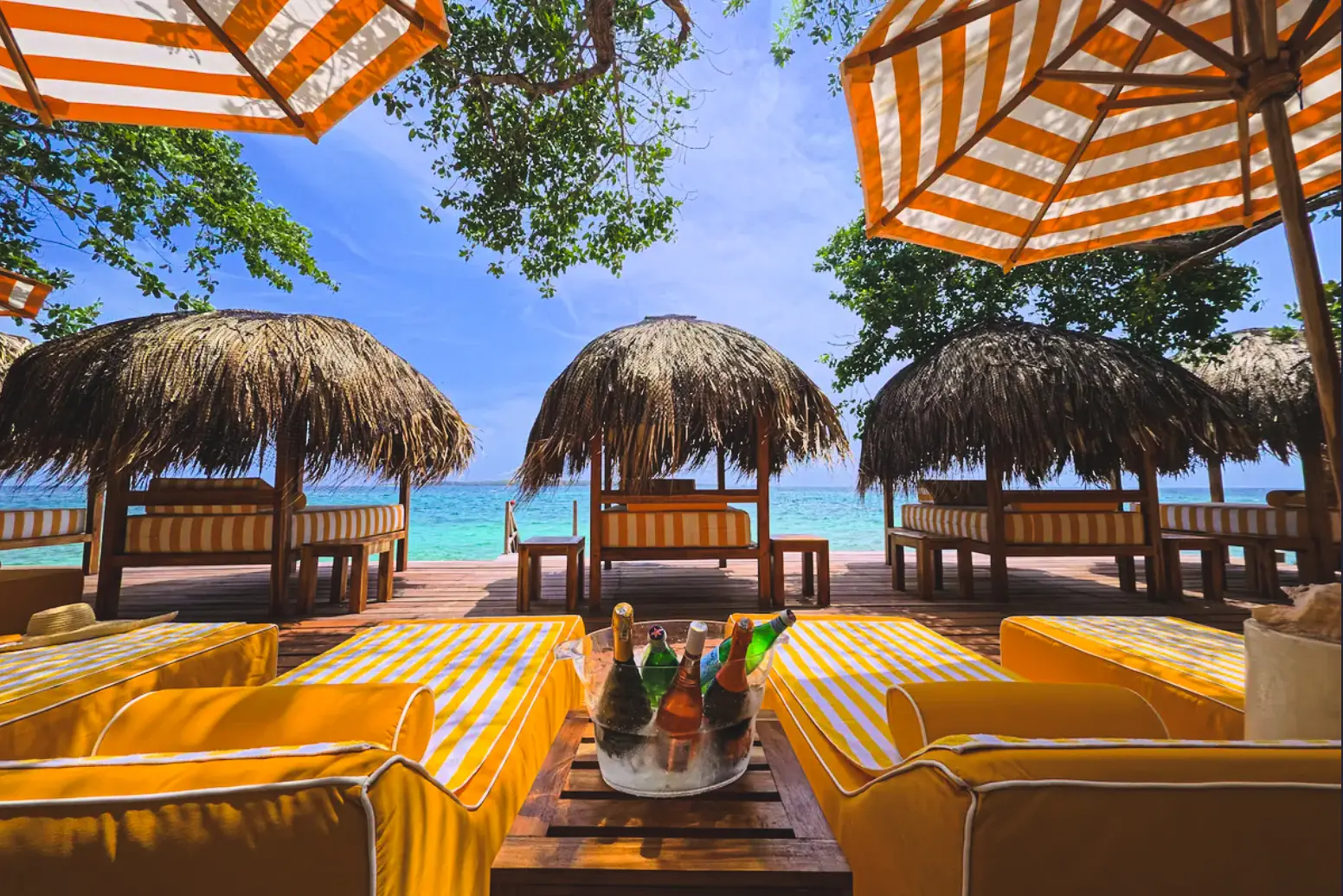 woman with a bob haircut holding a camera up to her face with a light in the background