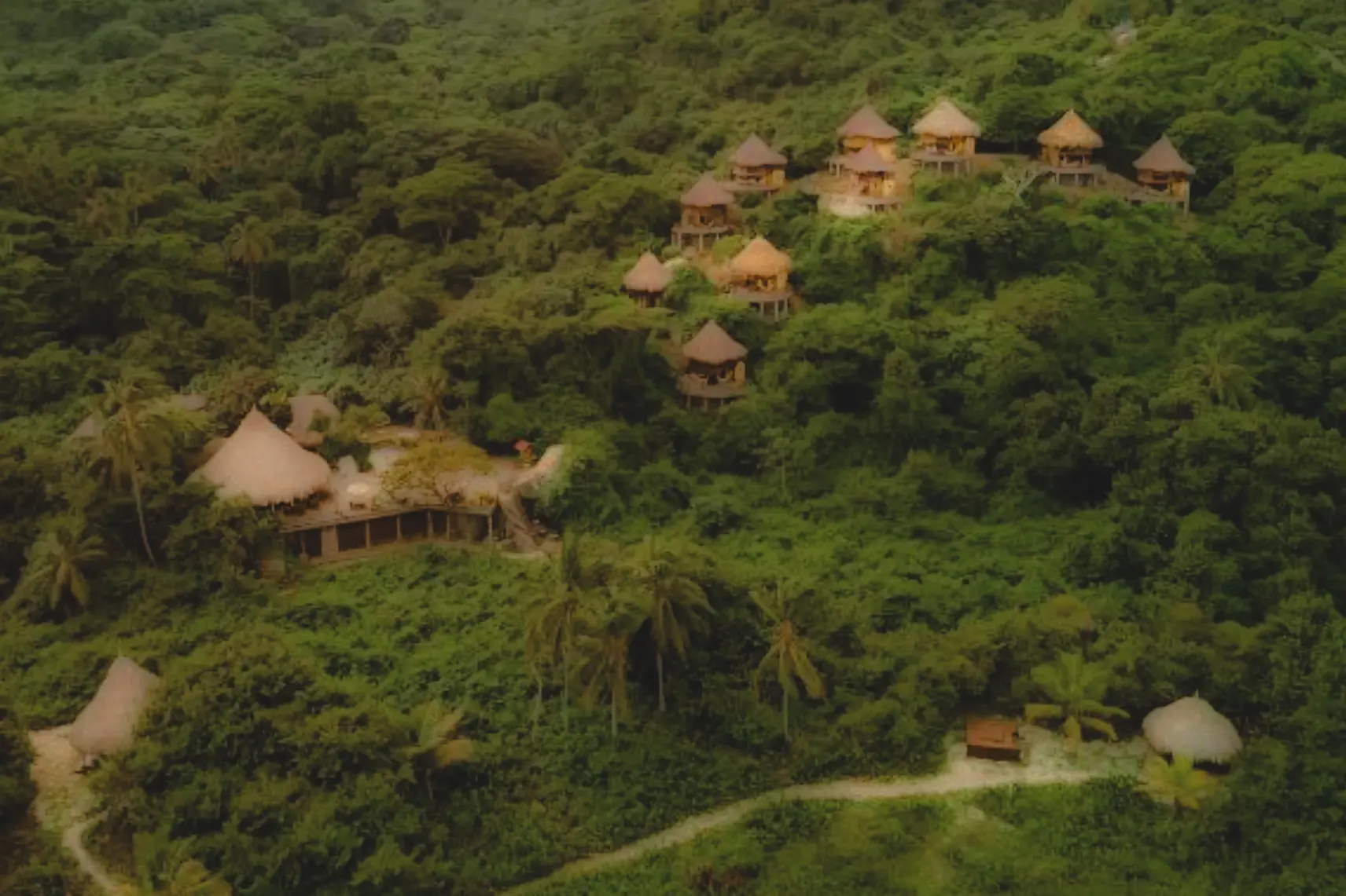 woman with a bob haircut holding a camera up to her face with a light in the background