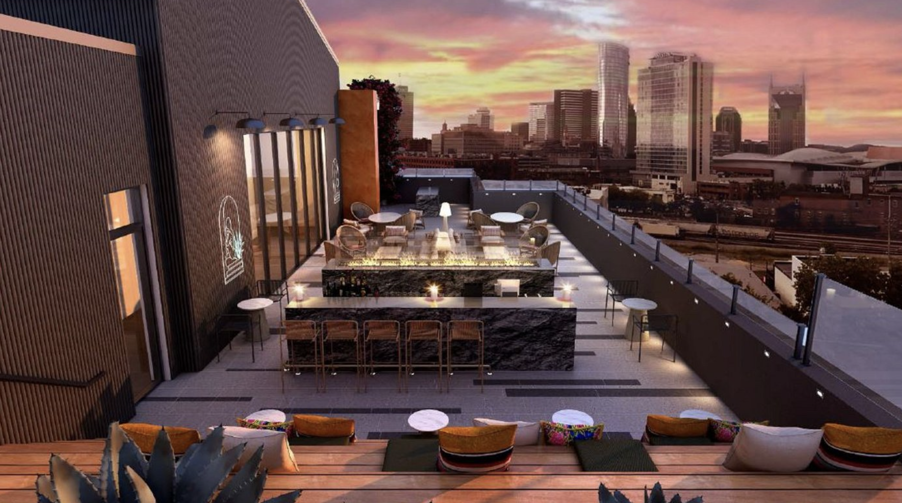 woman with a bob haircut holding a camera up to her face with a light in the background