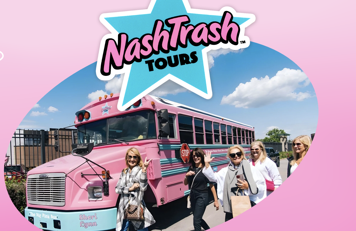 woman with a bob haircut holding a camera up to her face with a light in the background