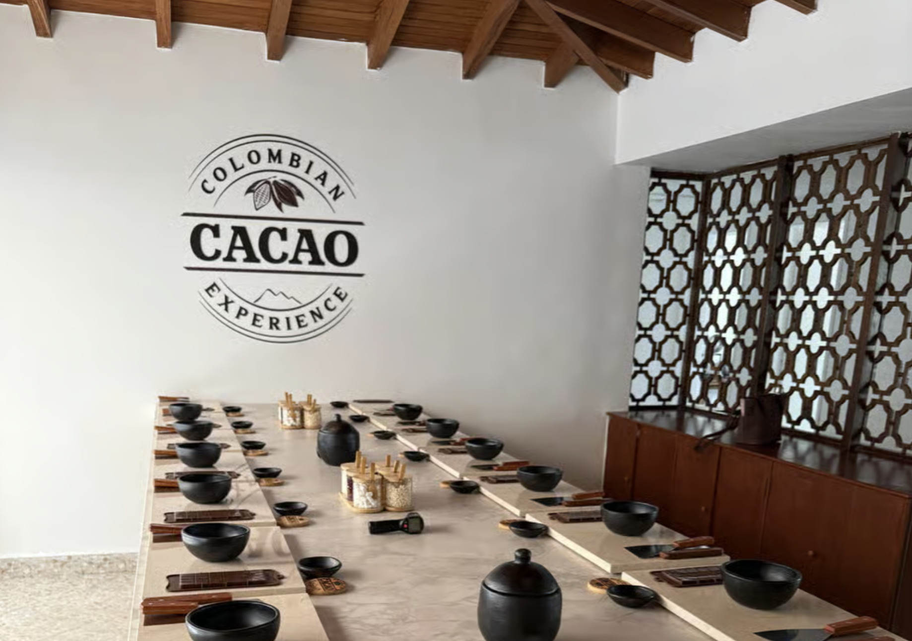 Colombia, Medellín, chocolate tour A kitchen counter with various tropical fruits and two plates of sliced fruit.