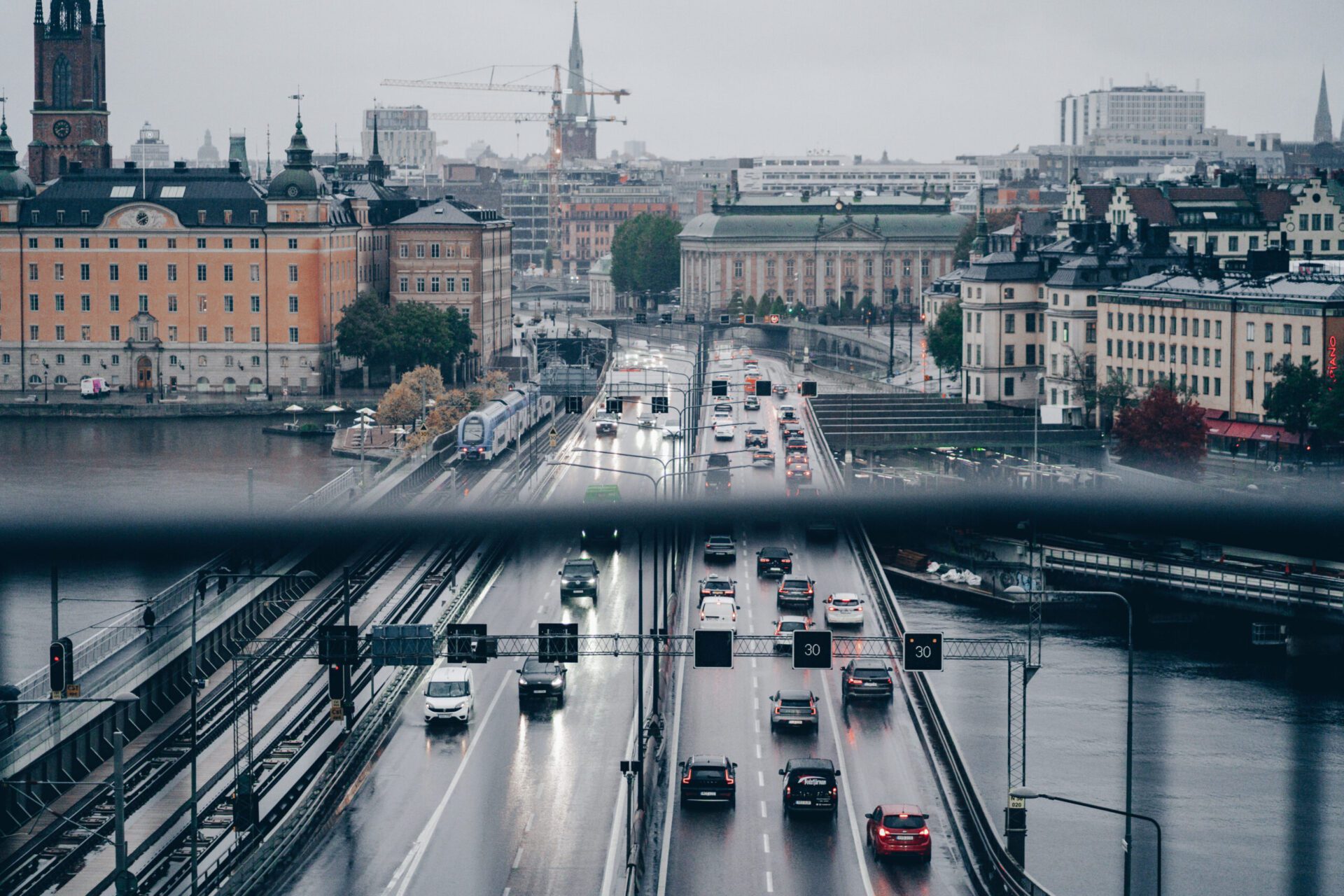 Dark, moody Stockholm city from a hotel view with the freeway below