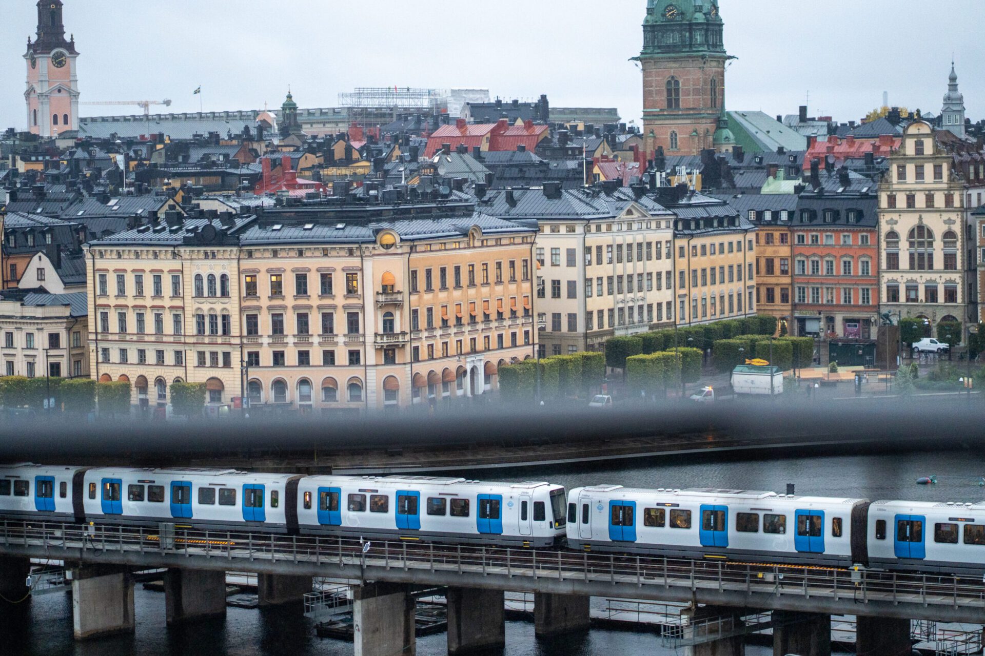Cloudy dark Gothic city with a metro running through it