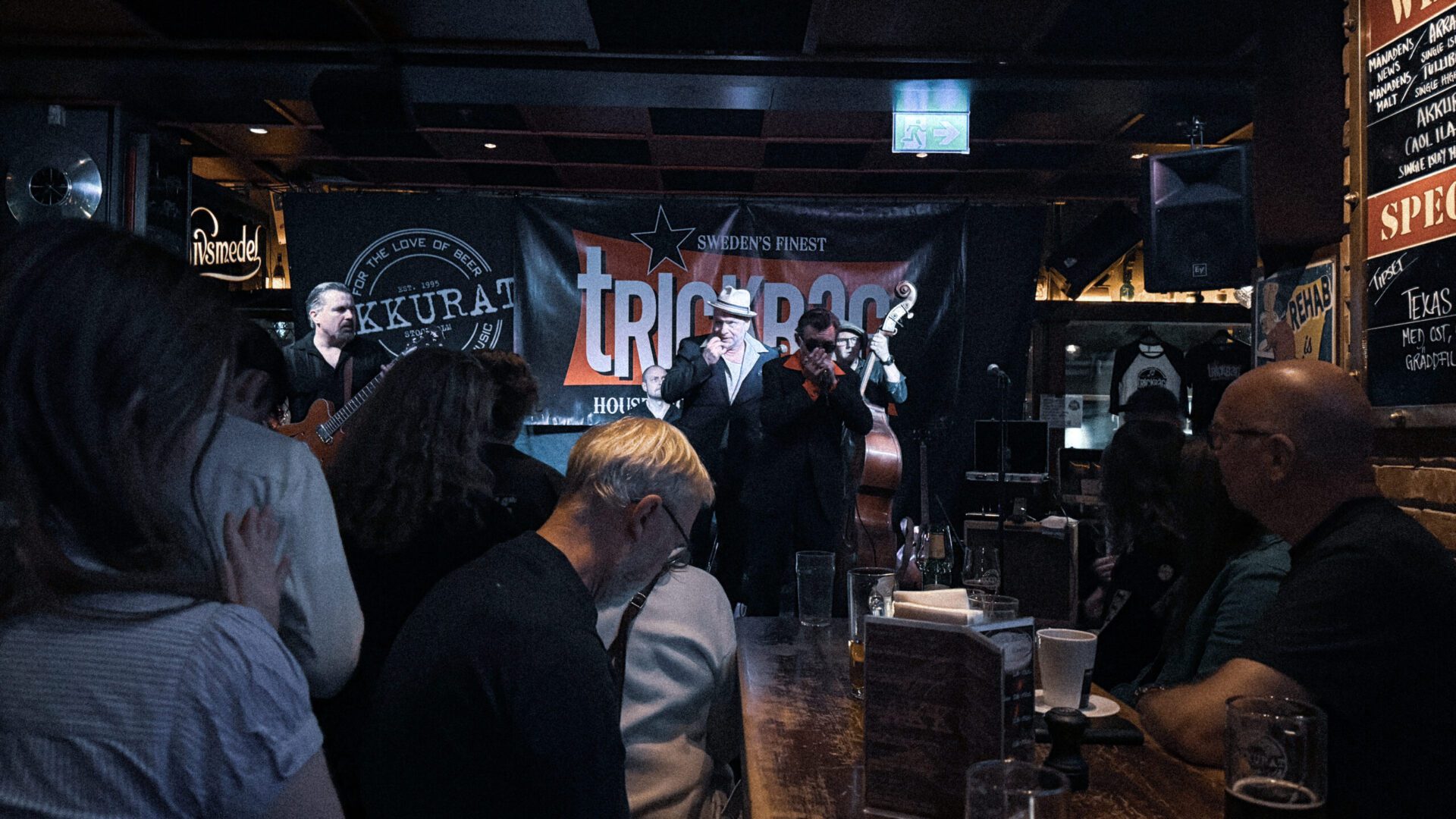 A band on stage at a bar