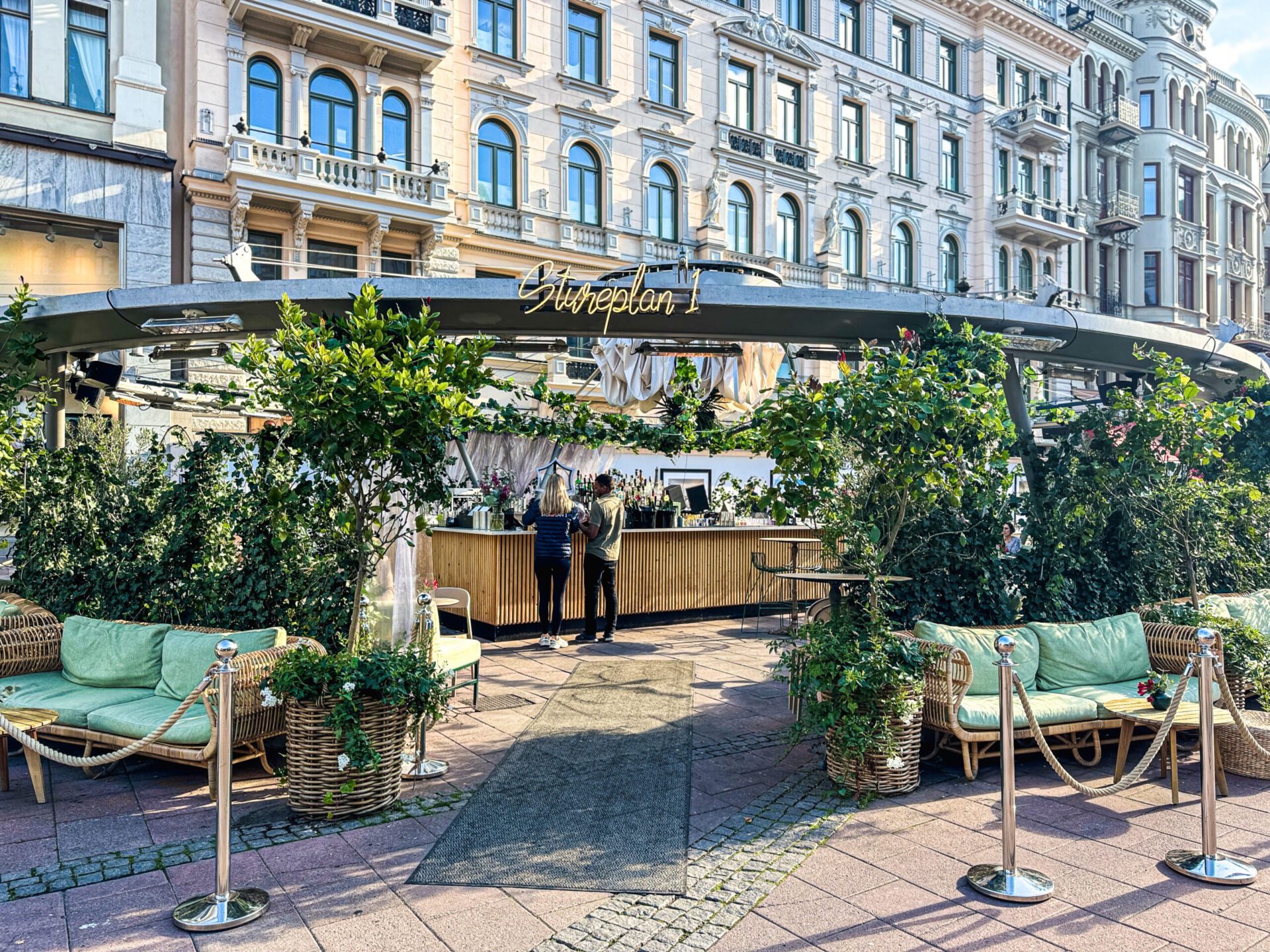Stureplan 1 outdoor restaurant with greenery and an open structure