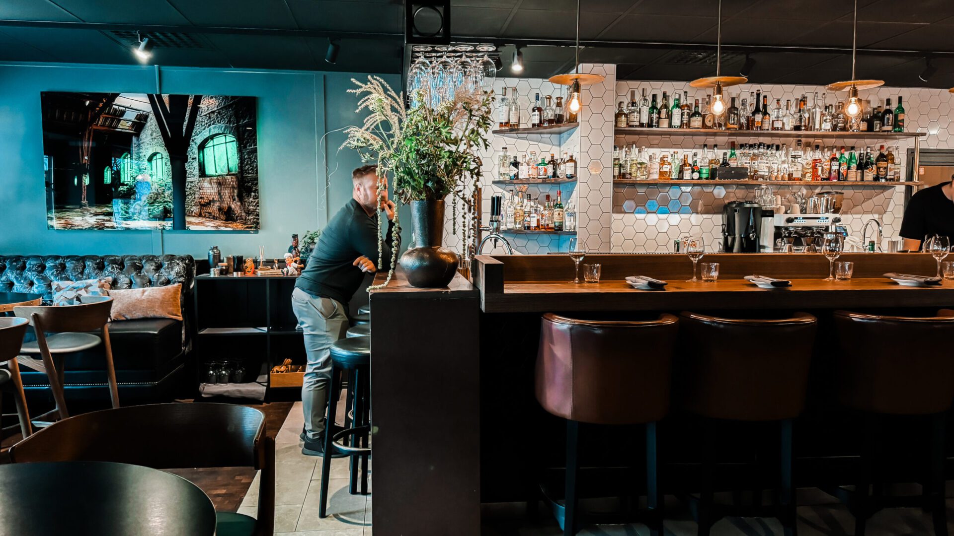 Man standing at a bar