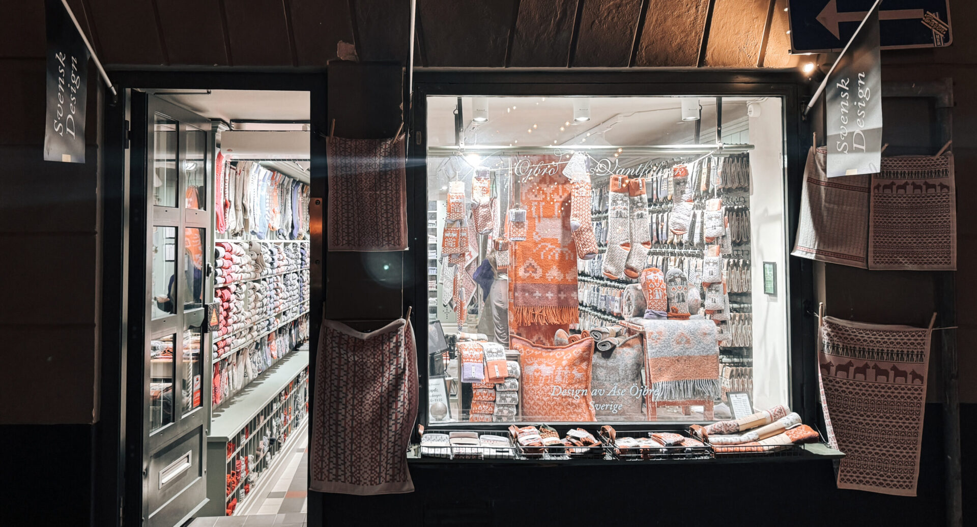A store window with knitted good inside